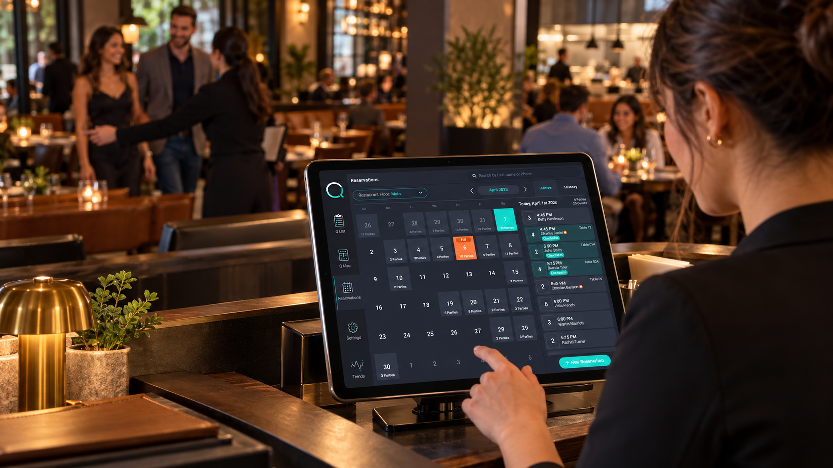 Host using QaTable at the restaurant host stand during lunch service